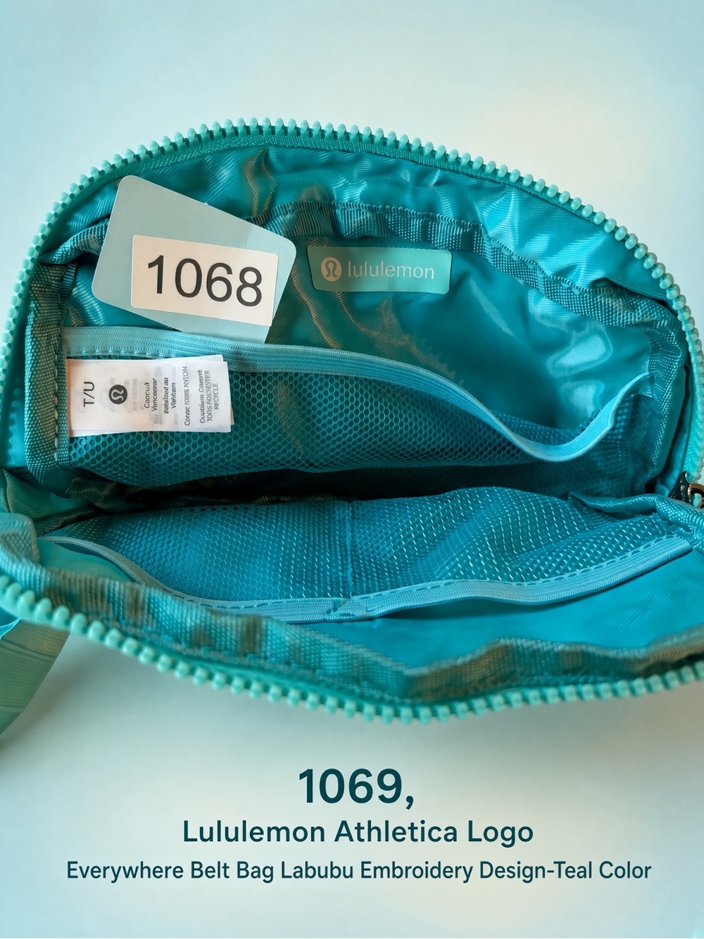 1069, Lululemon Logo Everywhere Belt Bag,Teal with Labubu embroidered design.